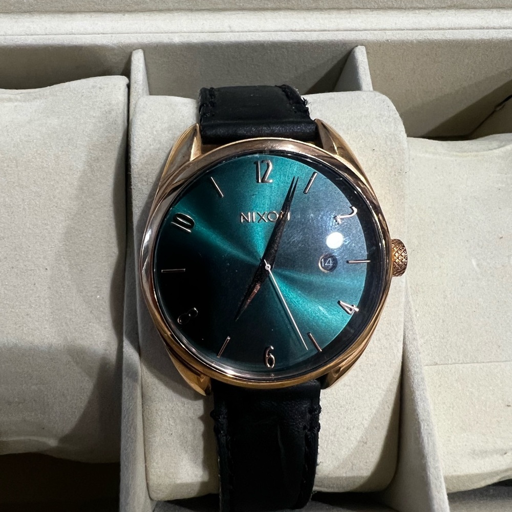 Nixon Black and Green Watch with Minimalist Design